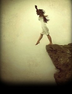 woman-on-cliffs-edge